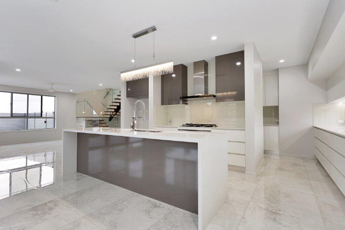 Brown And White Table In Kitchen — Kitchen design in Paget, QLD